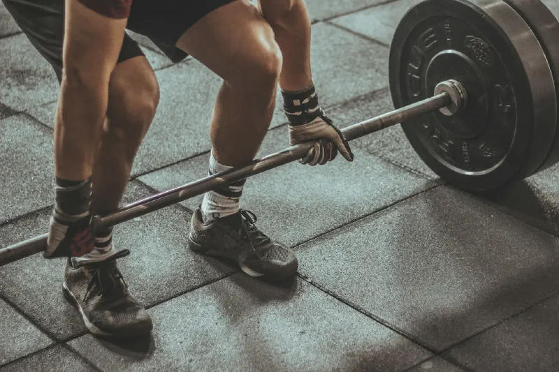 Adjustable and fixed dumbbell options for strength training in a small home workout space
