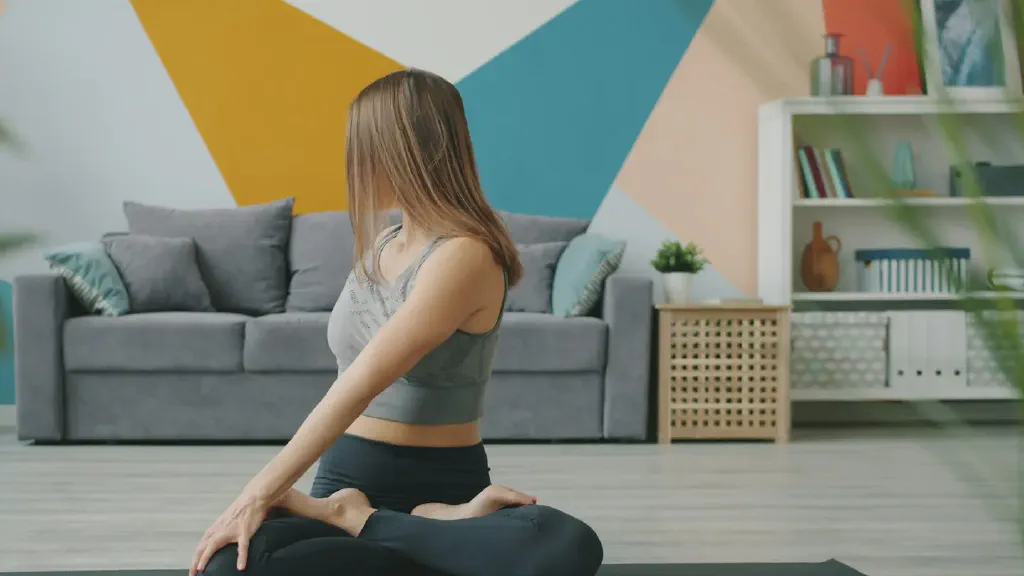 Resistance bands, an ab wheel and push-up bars arranged on a mat in a compact home workout space